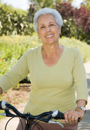 Mature contented woman on bike