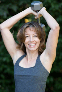 40 year old woman with dumbbell