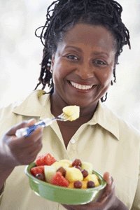 Mature woman eating salad